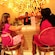 Guests at a bar socialize as they enjoy their drinks